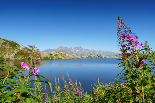 Lake le Lac Besson, Alpes d'Huez. French Alps. Reflection and blue sky. 