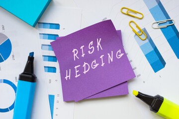  Financial concept about RISK HEDGING with sign on the page.