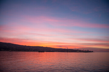 Sunset in Valpraiso city with harbor view and hills by Pacific Ocean, Chile.