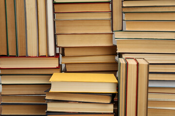 Fototapeta premium Many hardcover books as background. Library material