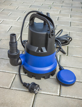 New low-power submersible pump with a plastic housing on a stone floor