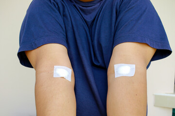 Man show two arm got vaccine. Senior healthcare medicine in new normal concept.