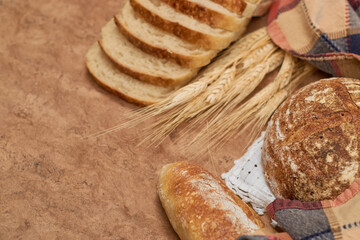 Variety of fresh Homemade Sourdough Bread on a rustic background