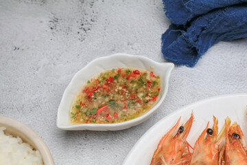 Thai style Hot and spicy seafood dipping sauce suitable for seafood on dinner table.