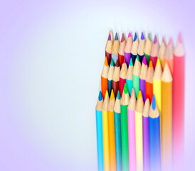 A large number of pencils standing upright in a pink vignette - Powered by Adobe
