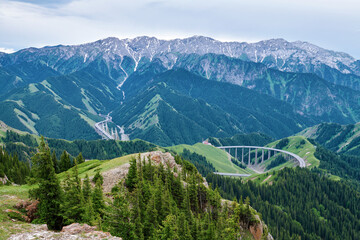 Naklejka premium Guozigou bridge in the mountains, Xinjiang autonomous regions, China.