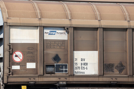 LJUBLJANA, SLOVENIA - JUNE 17, 2021: Logo of Rail Cargo Hungaryon a freight wago on a cargo train. Part of Rail Cargo Austria, it is a rail freight transportation company in Europe...