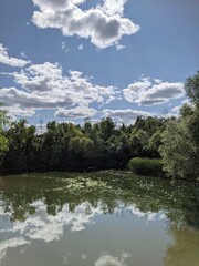 Obraz premium Clouds over the lake