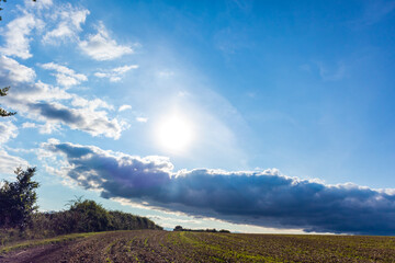 landscape with clouds and sun