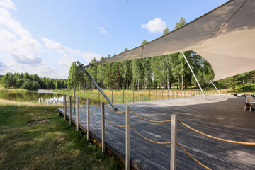Fototapeta premium Gazebo made of natural materials on the golf course, resting place. 