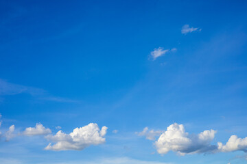 Beautiful bright blue sky with white clouds, nature background concept.
