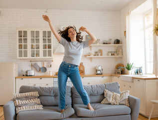 woman jumping on the sofa