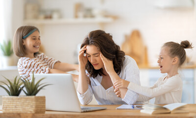 woman working on a laptop at home