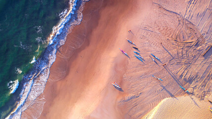 Fototapeta na wymiar Top down aerial view over beach with boards, Gold Coast.