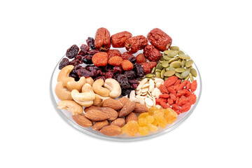 Group of whole grains and dried fruit in a glass plate isolated on white background.