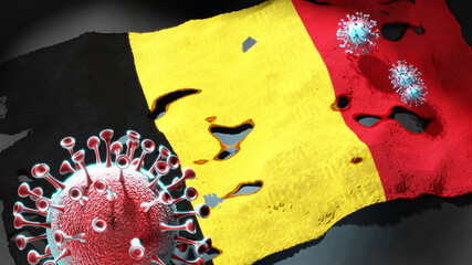 Covid in Belgium - coronavirus attacking a national flag of Belgium as a symbol of a fight and struggle with the virus pandemic in this country, 3d illustration