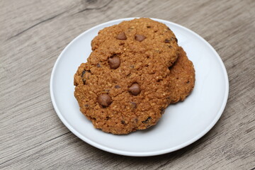 Delicious brown sugar oatmeal cookies on white plate