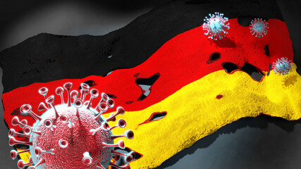 Covid in Germany - coronavirus attacking a national flag of Germany as a symbol of a fight and struggle with the virus pandemic in this country, 3d illustration