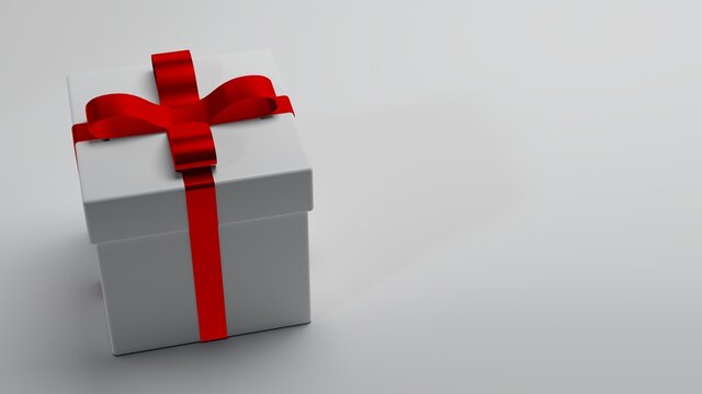 White gift box with red ribbon.
