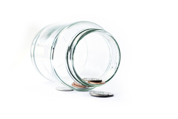 Coin into a glass jar isolated on white background. Financial business investment - Saving money concept
