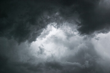 Naklejka na ściany i meble Turbulent dark stormy clouds angry and menacing