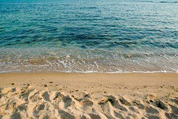calm morning scenery at the sea. empty sandy beach in morning light. relax and summer vacation concept. sunny weather with clouds on the sky