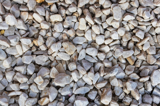 Rubble or gravel background, construction material. Pile of many small stones, stock photo