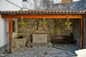 An ancient fountain in a street in the historic center of Castelsaraceno, a old town in the Basilicata region, Italy.