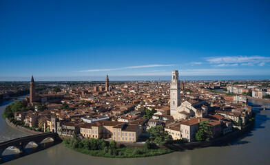 Fototapeta na wymiar Aerial panorama of Verona, Italy. Panoramic top view of Verona city center. Italian churches in the old city aerial view. Historic Italian town panorama top view. Italian medieval city drone view.