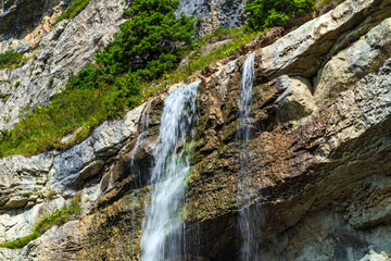 Beautiful high waterfall in the mountains