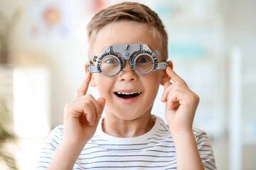 Little boy undergoing eye test in clinic © Pixel-Shot