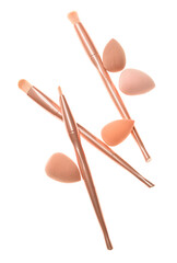 Set of cosmetic sponges and brushes on white background