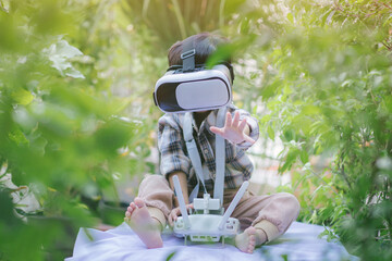 children in virtual reality glasses playing the game. little boy with vr headset and remote control...