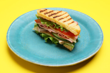 Plate with tasty sandwich on color background, closeup
