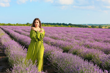 Beautiful young woman in lavender field