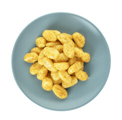 Plate with tasty pesto gnocchi on white background
