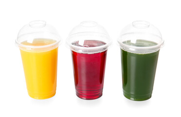 Plastic cups with healthy juice on white background