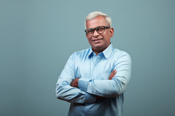 Portrait of a happy mature man of Indian ethnicity 
