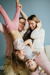 happy caucasian family at home having fun. Image with selective focus