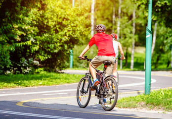 Cyclist ride on the bike path in the city Park
