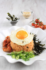 Korean Food: Bokkeumbap or Kimchi Fried Rice, South Korea Traditional Recipe Fried Rice with Kimchi, Spring Onion, Sesame Seed, and Nori (Laver) with Sunny Side Egg, Copy Space for Text