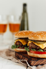  juicy burgers on a chopping board