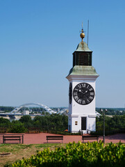 clock tower and bridge against blue sky