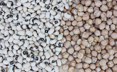 Spilled Black Eyed Peas and Chickpeas spilled on table