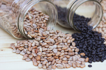 Jars of Black-eyed Peas, Chick Peas, Black Beans and Pinto Beans Spilled in Kitchen