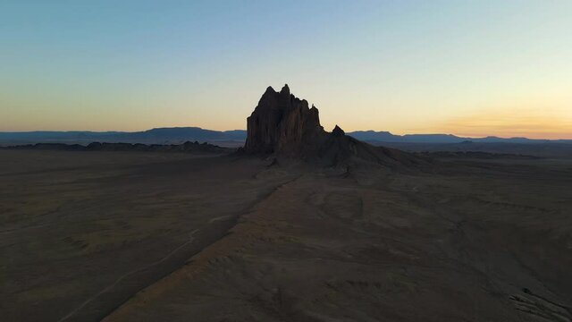 Cinematic aerial shot of iconic monolith in Shiprock in New Mexico
