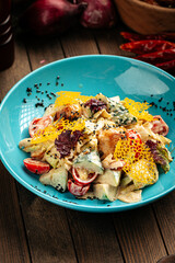 Bowl of gourmet salad with smoked chicken and cheese
