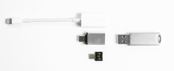 Portable USB flash drive with adapters isolated on white background. Mockup. High quality photo