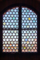 Palace of the praetor
Certaldo, Tuscany, Italy.
The window in the old house in palace of the praetor is decorated colored glass