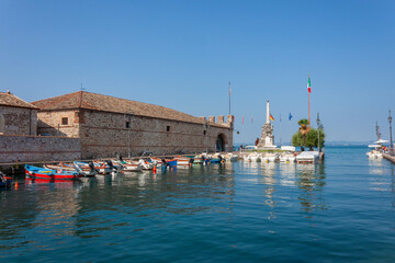 Small old port in the center of Lazise, tourist resort on the coast of Lake Garda, Verona province, Veneto, Italy.
